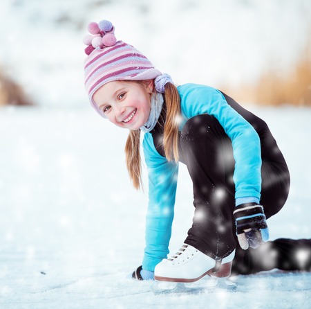 happy cute little girl skatingの写真素材