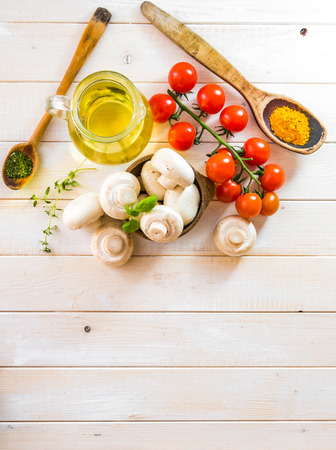 food ingredients for cooking vegetarian food on a wooden backgroundの写真素材