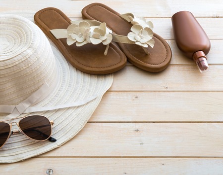 beach accessories on a white wooden backgroundの写真素材