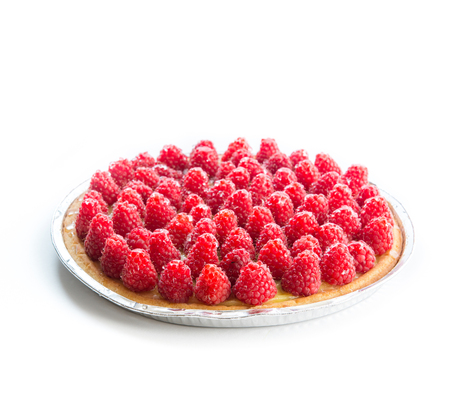 Tart with raspberries on a white background