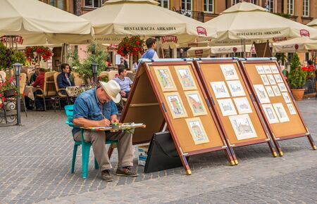 WARSAW, POLAND - JUNE 20, 2015:  Street in the old town near the market square. A popular place among tourists in June 20, 2015 in Warsaw, Poland.のeditorial素材