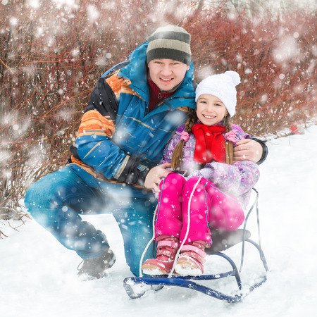 Winter portrait of happy young family