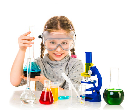 happy little girl with flasks for chemistry isolated on a white backgroundの写真素材