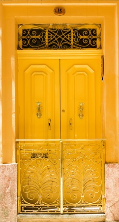 colourful yellow front door to houseの写真素材