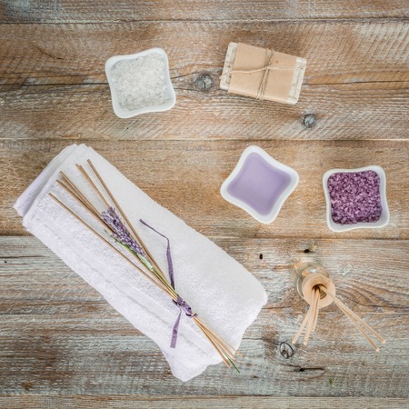 Composition of spa treatment items on the wooden table. Top view