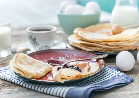 russian puncakes and ingredients on wooden backgroundの写真素材