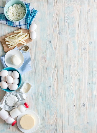 set of dairy products on wooden background with text space top viewの写真素材