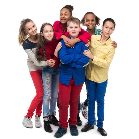 group of friends in colorful clothes standing and embracing isolated on white backgroundの写真素材