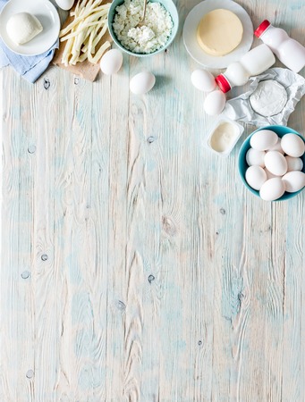 set of dairy products on wooden background with text space top viewの写真素材