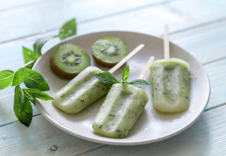 homemade ice cream with kiwi, topviewの写真素材