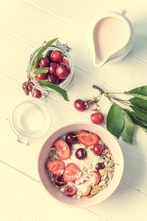 Healthy breakfast with muesli and cherries, topviewの写真素材