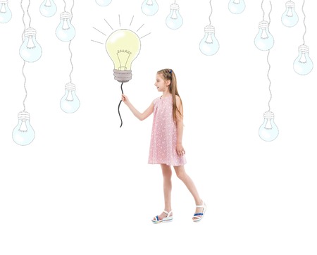 teen girl holding lightbulb, idea and creativityの写真素材