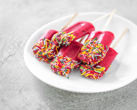 ice pop made with red berries and sprinkles, closeupの写真素材