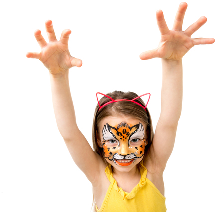 lovely little girl with painted face making selfieの写真素材