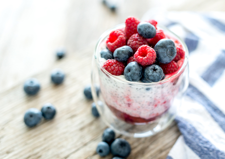 Dessert from yogurt with chia seeds, raspberries and blueberriesの写真素材
