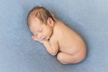sleeping newborn boyの写真素材