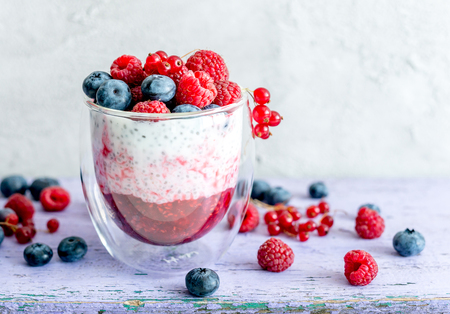 Dessert from yogurt with chia seeds, raspberries and blueberriesの写真素材