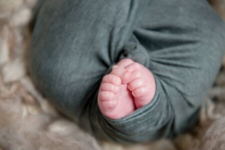 Little baby feet of a newborn babyの写真素材
