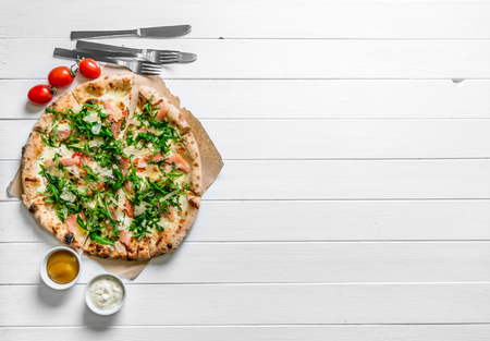 Italian pizza on white wooden backgroundの写真素材