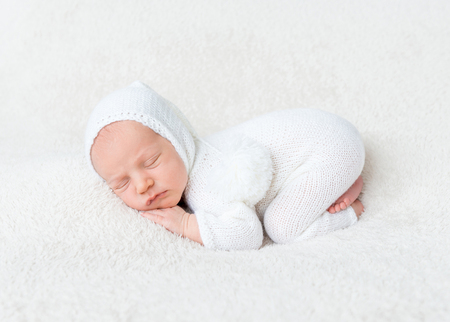 Infant boy in white bodysuitの写真素材
