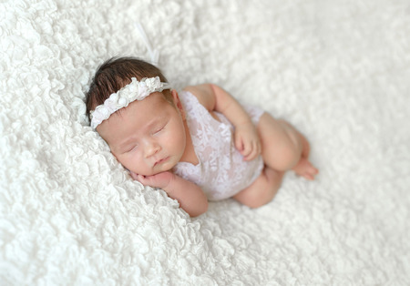 sleeping newborn baby girlの写真素材