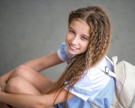 portrait of a cute curly teenager girlの写真素材