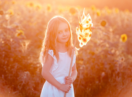 cute little girl with a windmillの写真素材