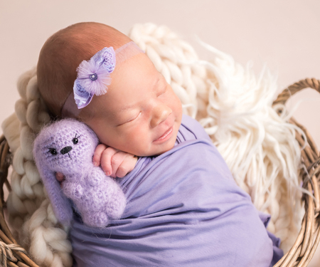 sleeping newborn baby girlの写真素材