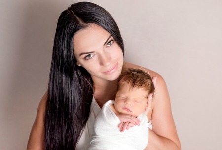 Mother holding little babyの写真素材