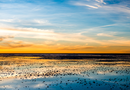 Amazing sunset scenery on Salar de Uyuniの写真素材