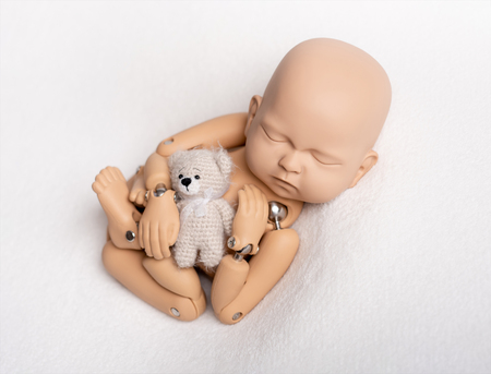 Toy of newborn baby for photo practiceの写真素材