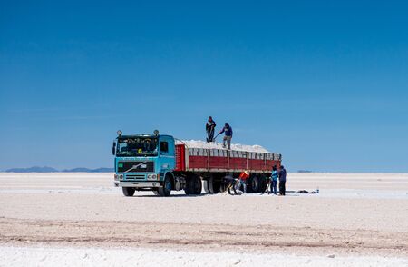 Bolivia - October 21, 2018: People working on salt flatsのeditorial素材