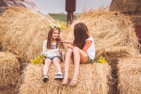 Two girls on a fieldの写真素材