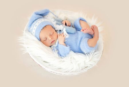 Beautiful newborn in cradleの写真素材