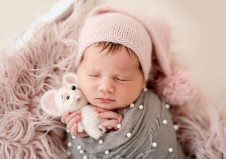 Cute newborn with toyの写真素材