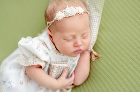 Newborn resting on pillowの写真素材