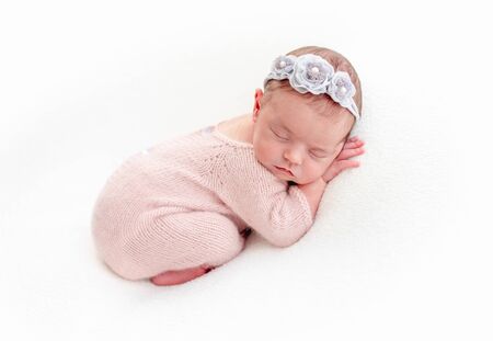 Cute newborn sleeping on stomachの写真素材
