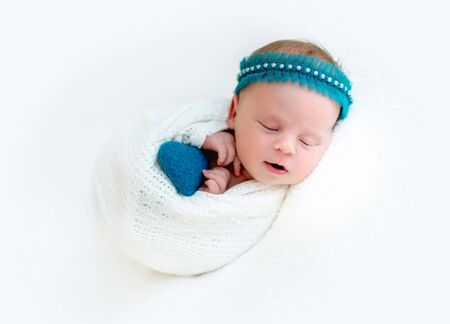 Sleeping newborn baby girl