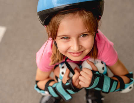 Little girl roller on road backgroundの写真素材