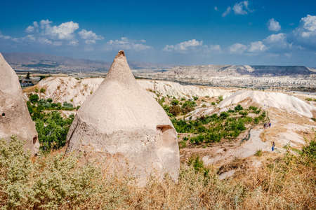 Cave dwelling on turkish natural landscape backgroundの写真素材