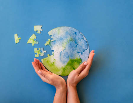 Jigsaw puzzle in shape of globe