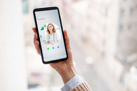 Smartphone with dressmaker contact on screen