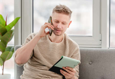 Man freelancer with notepadの写真素材