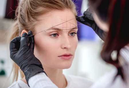 Master making eyebrows permanent makeupの写真素材