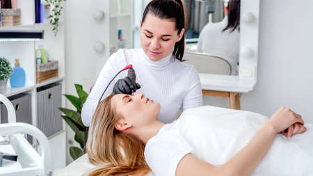 Master making eyebrows permanent makeupの写真素材