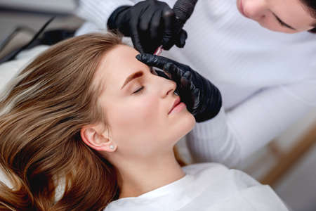 Master making eyebrows permanent makeupの写真素材