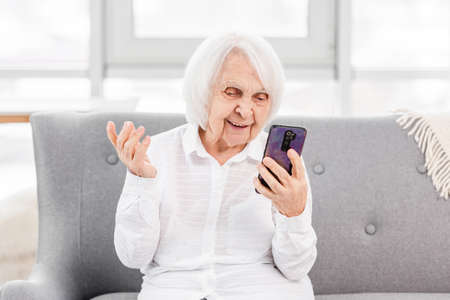 Elderly woman with smartphone
