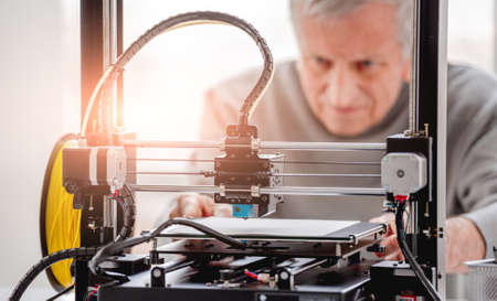 Man with 3D printer