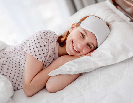 Girl smiling in the bed