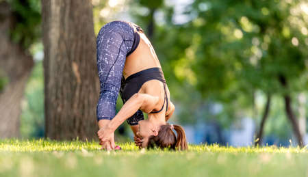Girl doing yoga at nature